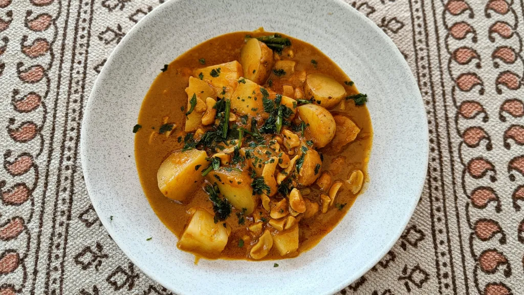 Photograph of Potato, pineapple & cashew curry.
