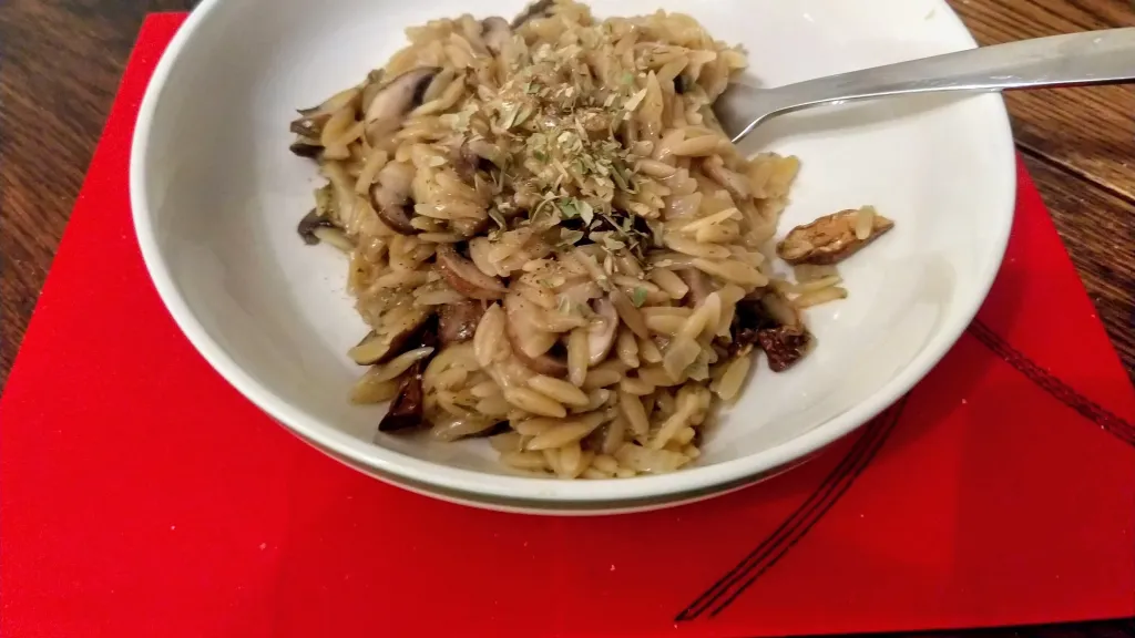 Photograph of Rich one-pan mushroom orzo risotto.