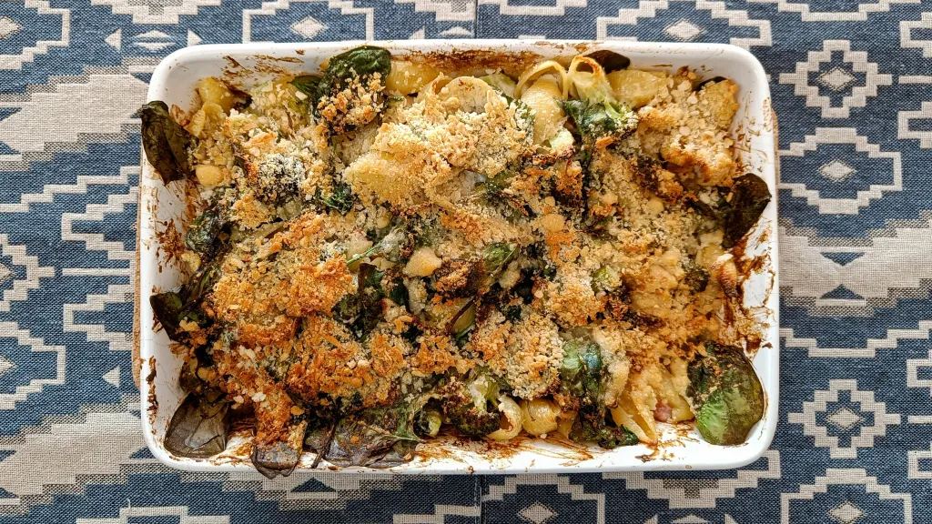 Photograph of Roasted broccoli & bacon conchiglie bake with lemon crème fraîche.