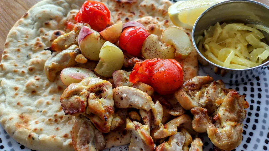 Photograph of Saffron chicken kababs with peaches.