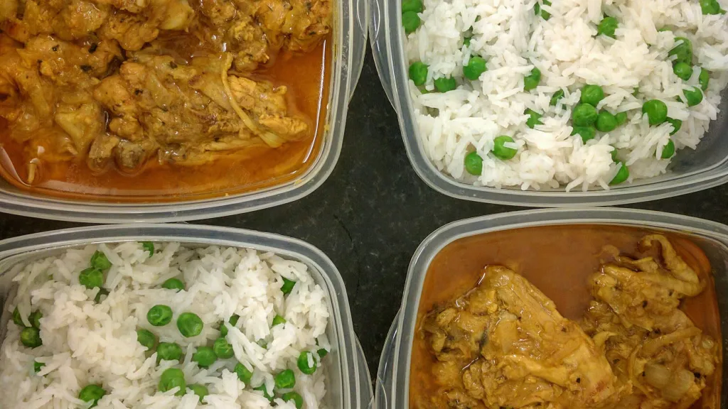 Photograph of Saffron ginger chicken with rice and naan bread.