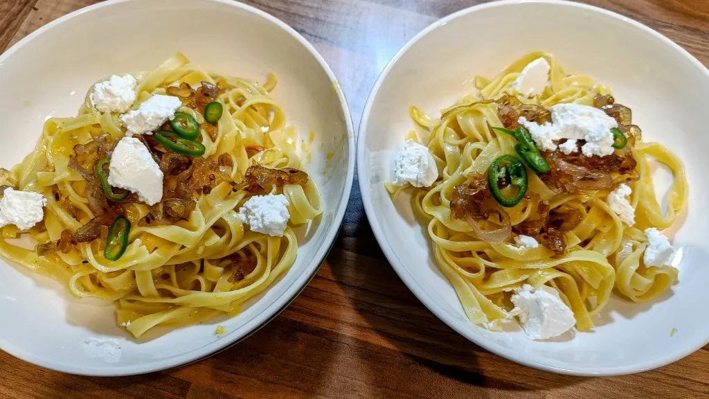 Photograph of Saffron tagliatelle with ricotta and crispy chipotle shallots.
