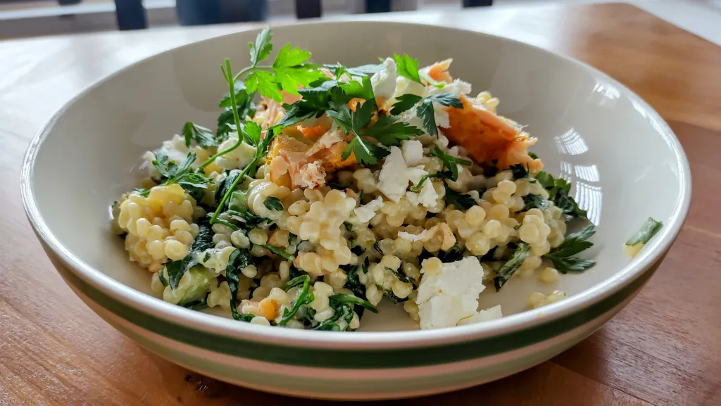 Photograph of Salmon and couscous salad with cucumber-feta dressing.