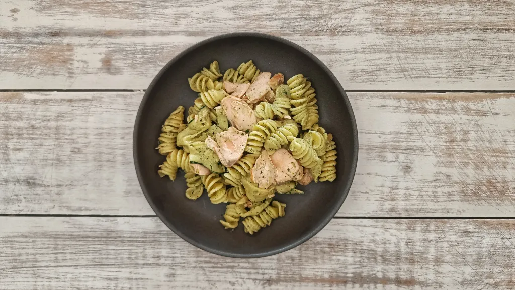 Photograph of Salmon, courgette and lemon pasta with a herby dressing.