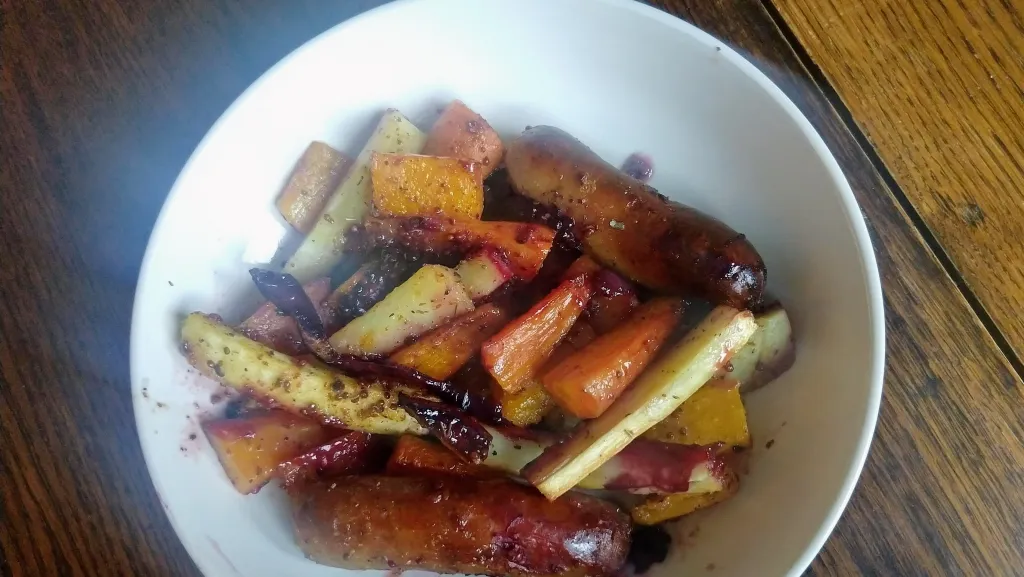 Photograph of Sausage, sage and blackberry traybake.