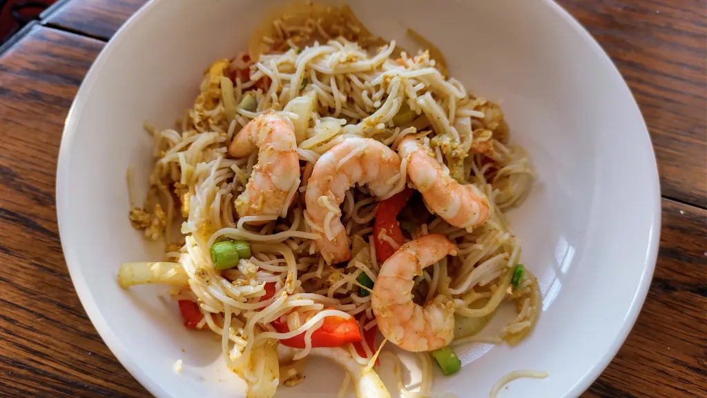 Photograph of Singapore noodles with prawns.