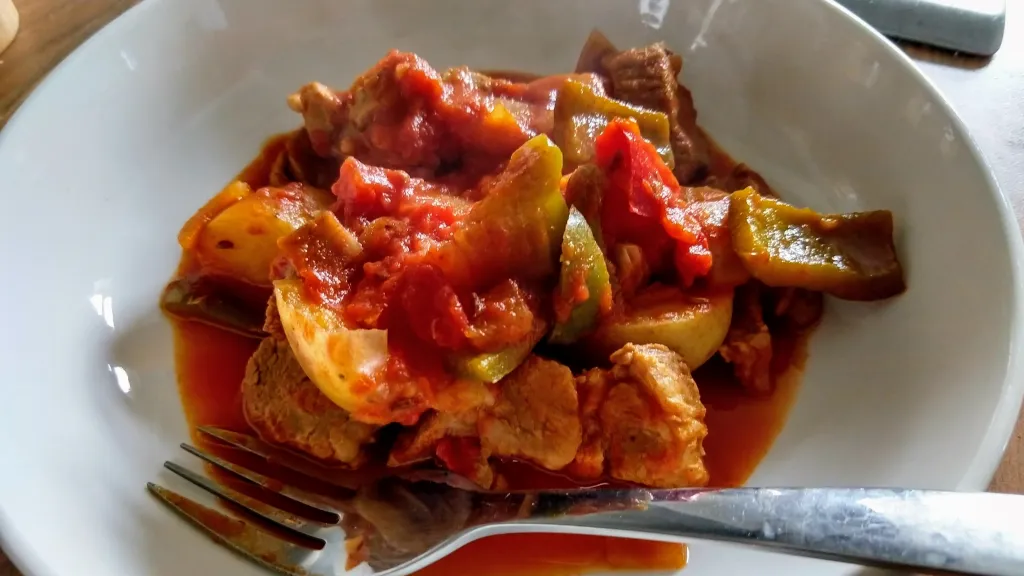 Photograph of Smoked paprika pork stew with peppers and potatoes.