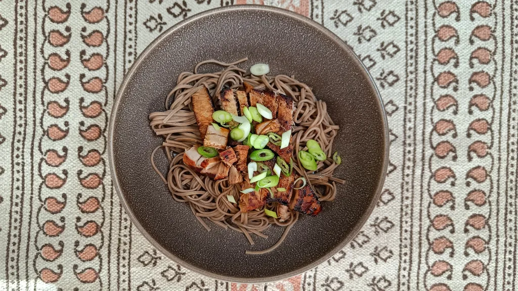 Photograph of Soy & mirin tuna on soba noodles.