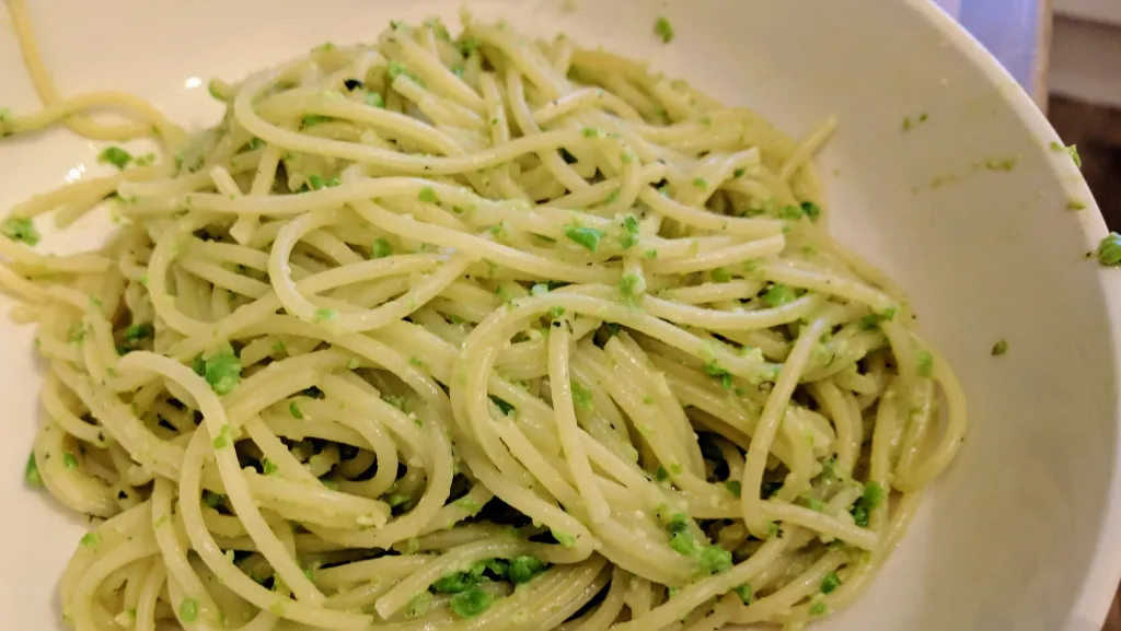 Photograph of Spaghetti with pea and mint pesto.
