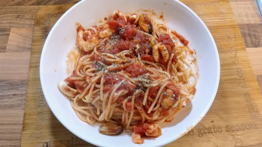 Photograph of Spaghetti with smoky tomato & seafood sauce.