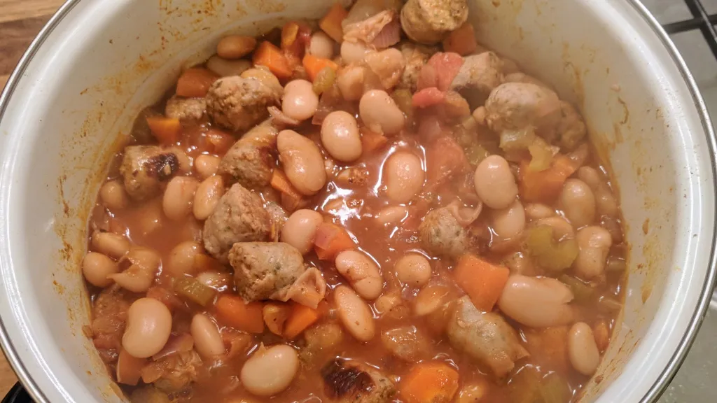 Photograph of Spiced bean & banger stew.