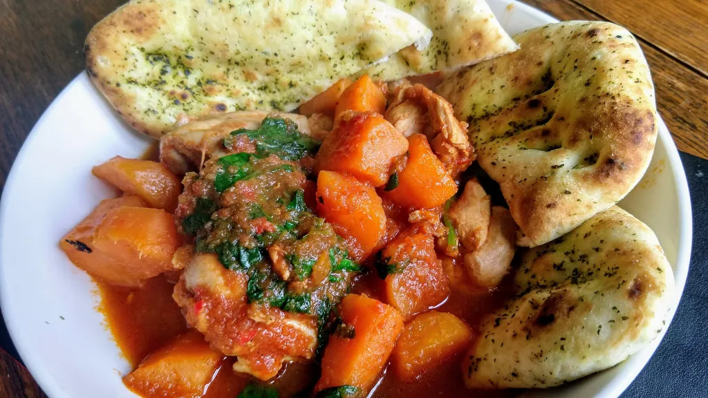 Photograph of Spiced chicken, spinach & sweet potato stew.