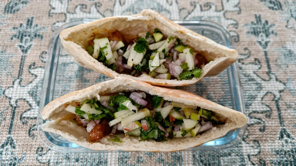 Photograph of Spiced pork wraps with green apple salsa.