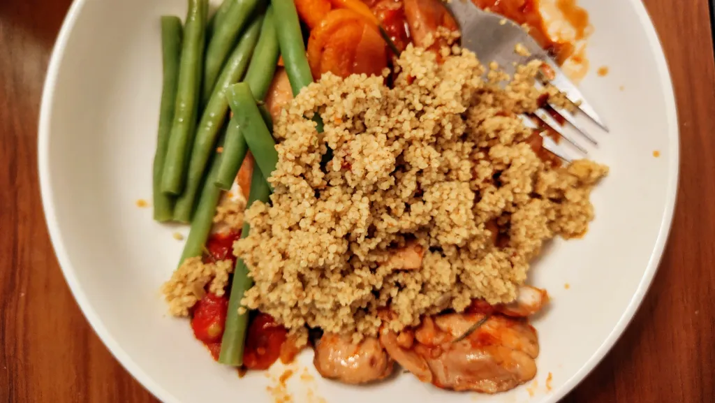 Photograph of Spicy chicken tagine with apricots, rosemary and ginger.