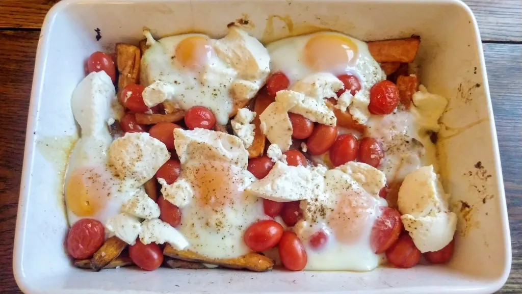 Photograph of Spicy sweet potato, tomato, ricotta and egg bake.