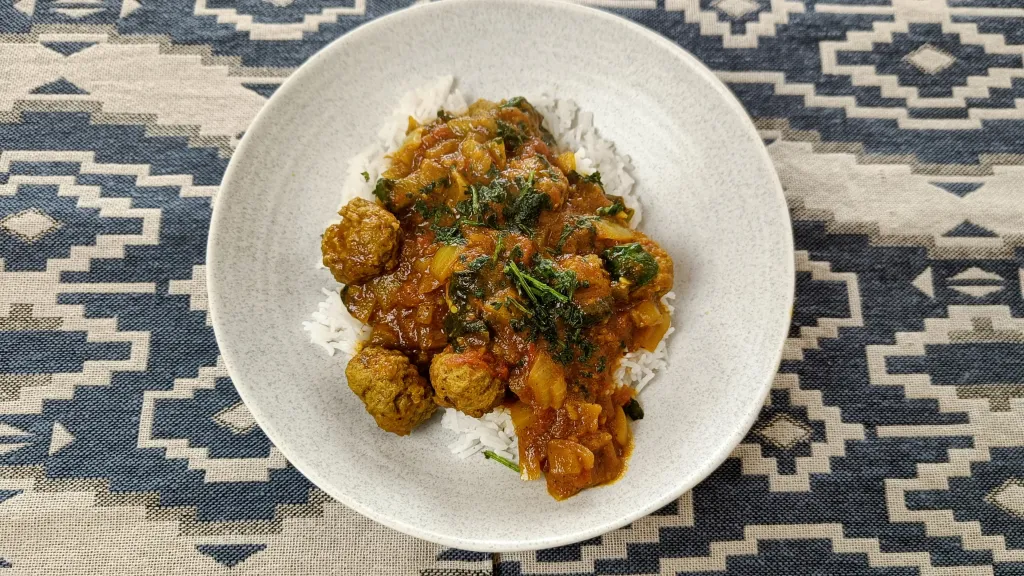 Photograph of Spinach meatball curry.