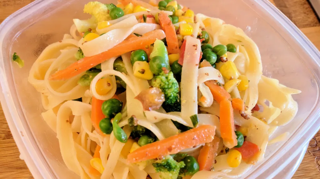 Photograph of Spring vegetable tagliatelle with lemon sauce.