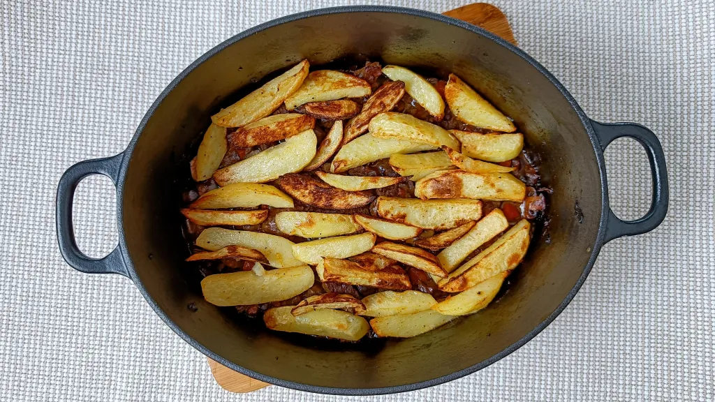 Photograph of Steak and chips pie.
