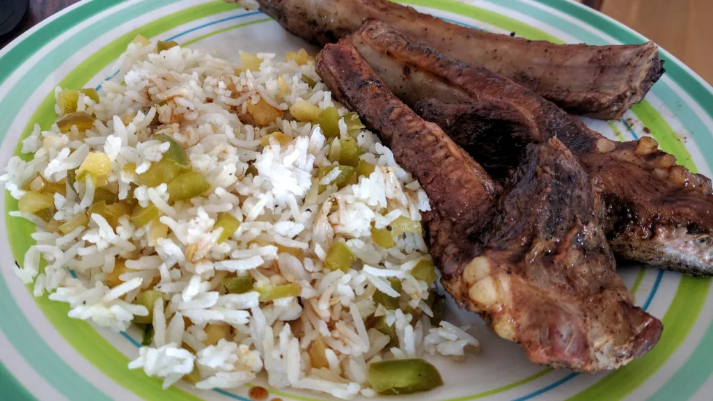 Photograph of Sticky jerk & brown sugar ribs with pineapple rice.