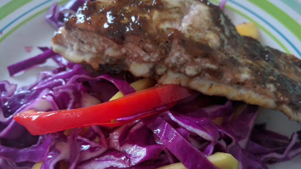 Photograph of Sticky jerk salmon with mango slaw.