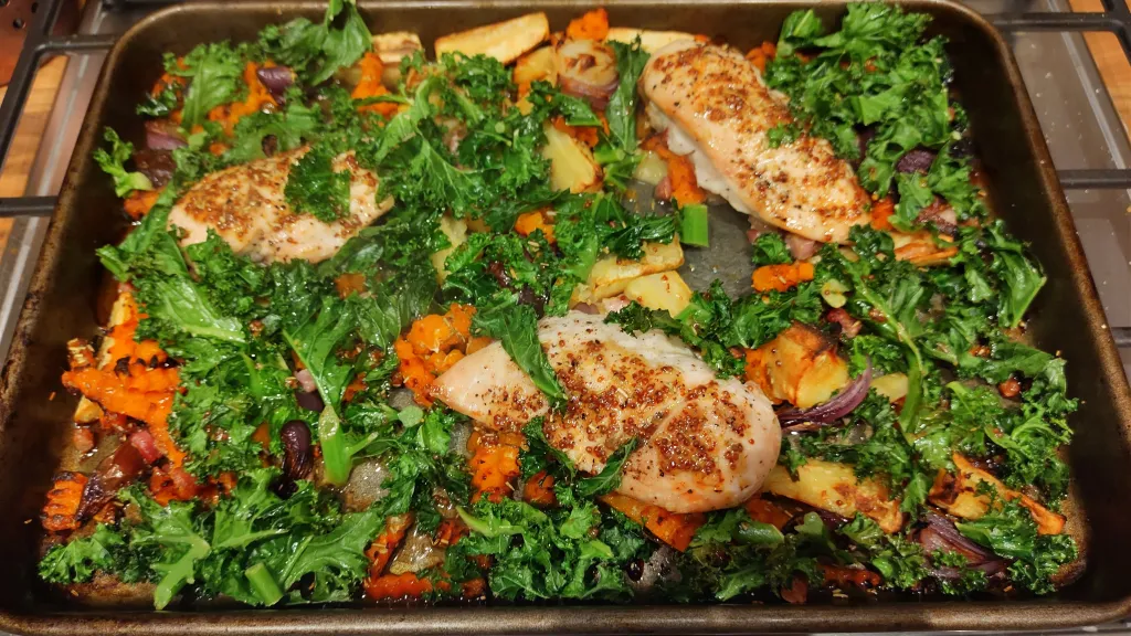Photograph of Sticky maple chicken traybake.