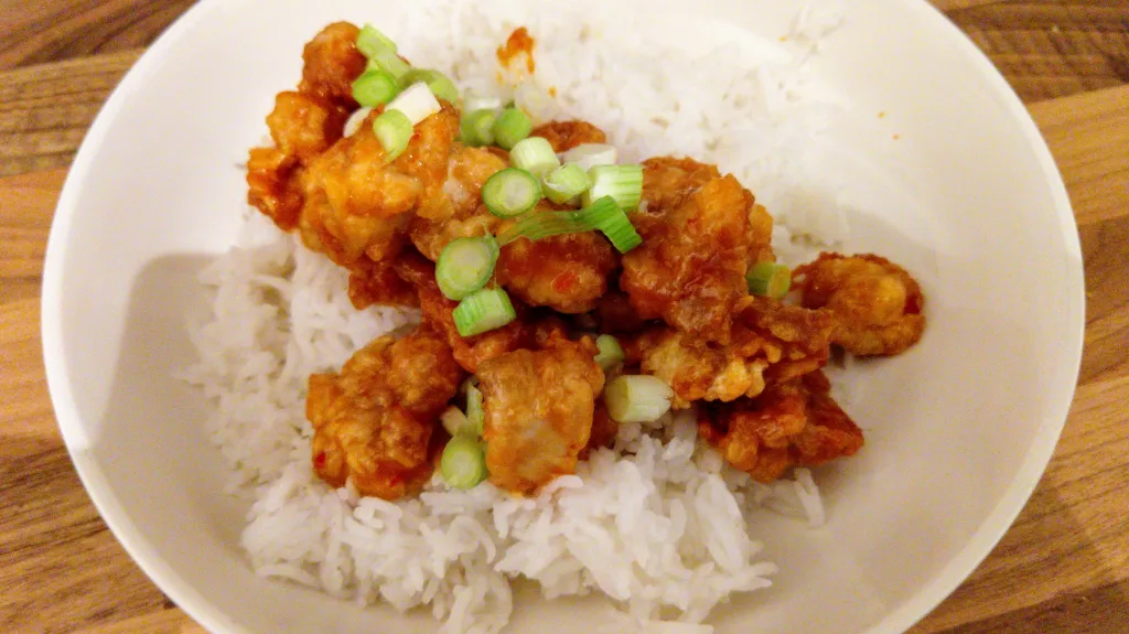 Photograph of Sticky sesame popcorn chicken.
