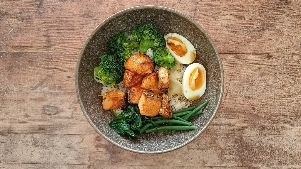 Photograph of Sticky soy sauce salmon rice bowl.