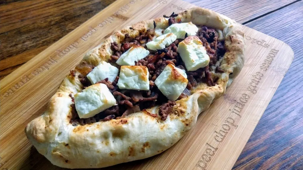 Photograph of Sumac-spiced lamb pides.