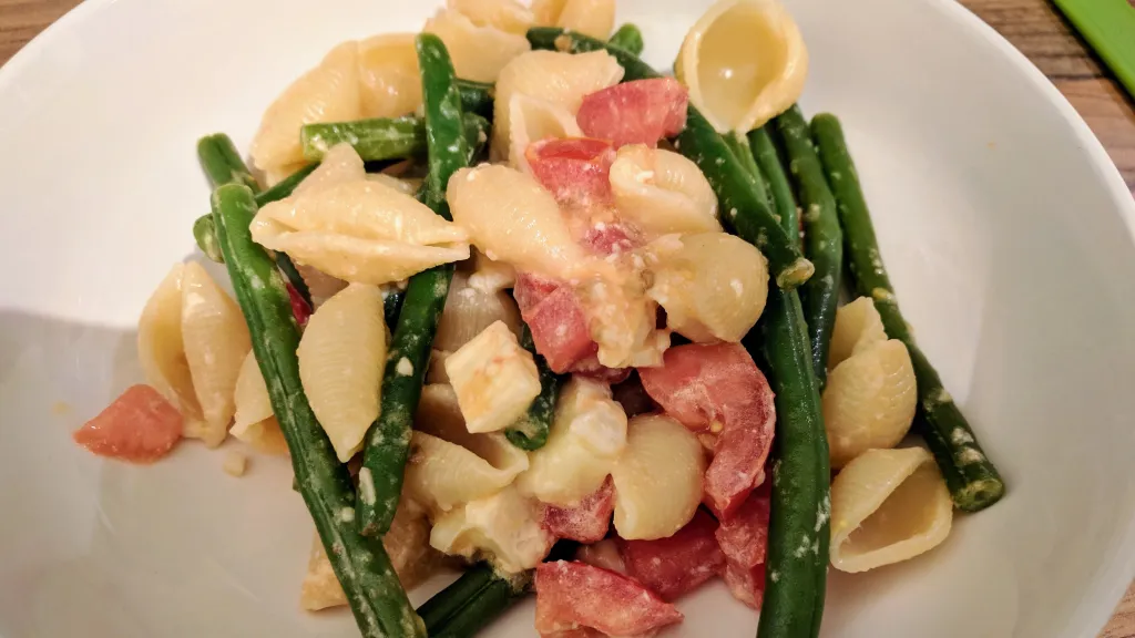 Photograph of Summer pasta with melting brie.