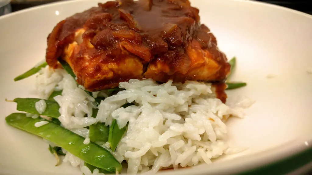 Photograph of Sweet and sour fish with coconut rice and mangetout.