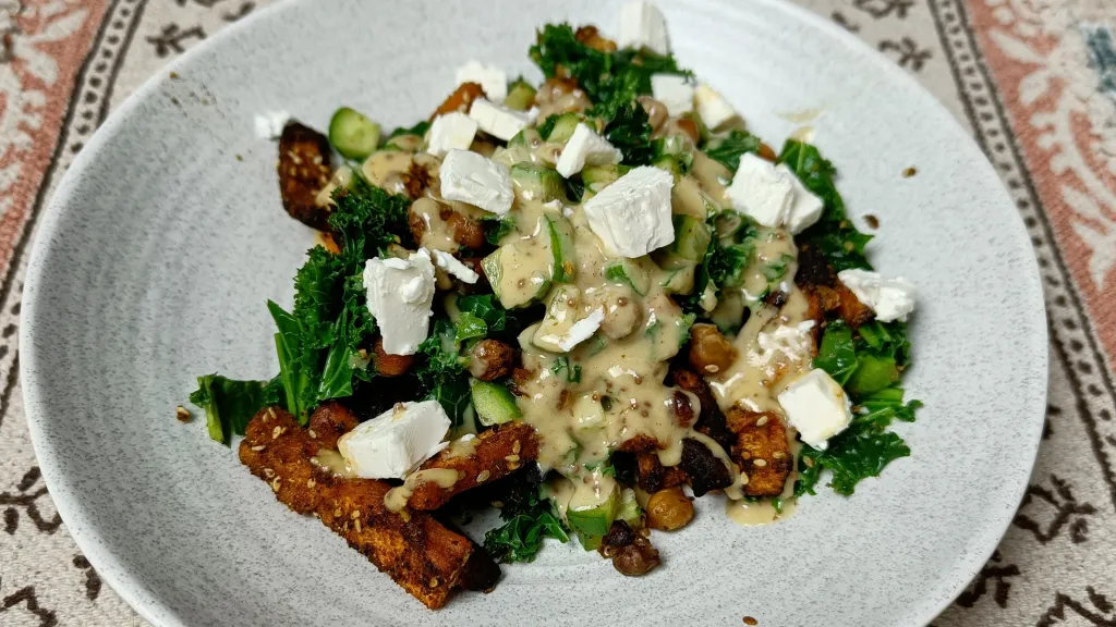 Photograph of Sweet potato kale salad with creamy honey mustard dressing.