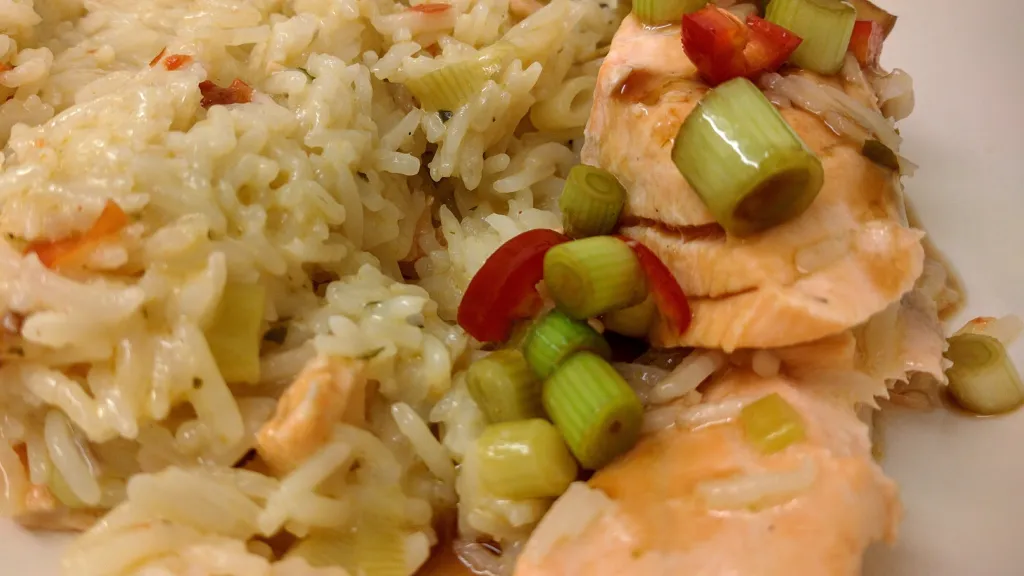 Photograph of Thai salmon with coconut rice and green chilli dressing.