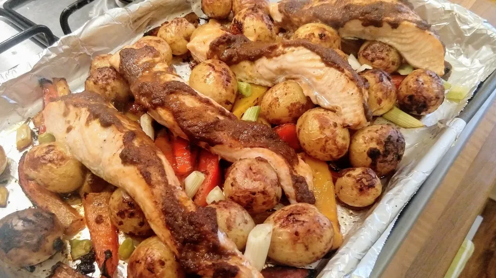 Photograph of Tikka salmon traybake.