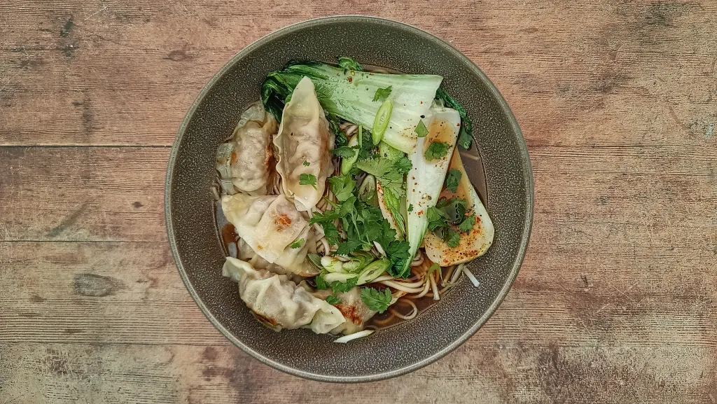 Photograph of Yasai gyoza ramen.