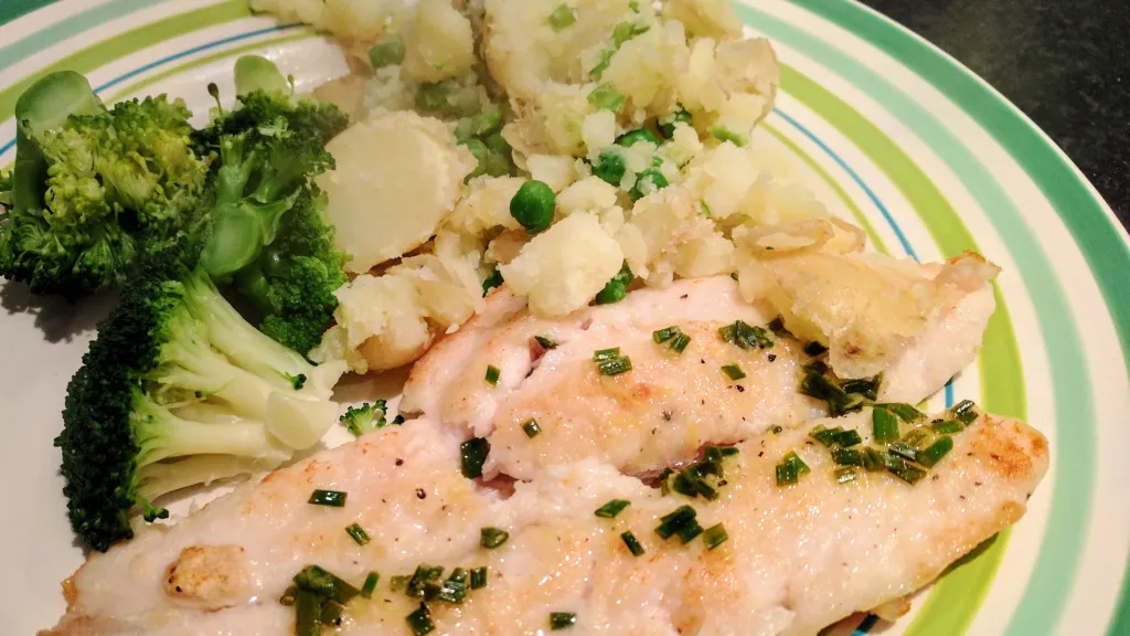 Photograph of Zesty haddock with crushed potatoes & peas.